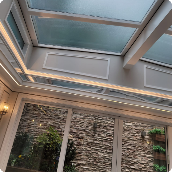Modern skylight installation with stone accent wall
